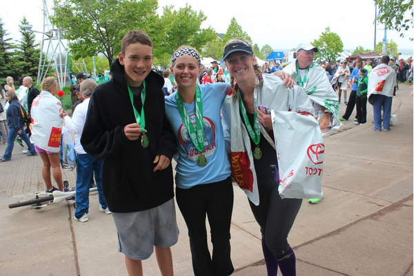 Jessica, right, with family at the finish line.